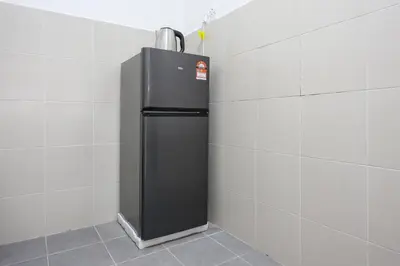 a black refrigerator in a corner of a wall at Serenity Retreat, Nature & Comfort Stay Brinchang Cameron Highland -Clover Home 5-21 in Brinchang