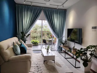 a living room with a couch and a tv at Hygee Home At Emerald Avenue Brinchang in Brinchang