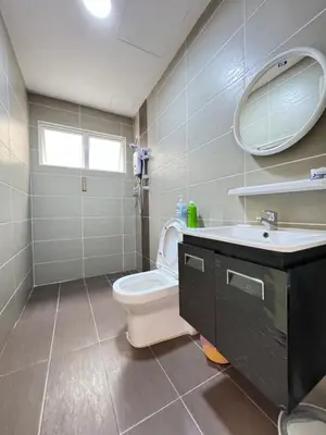 a bathroom with a toilet and a sink and a mirror at Rich field Cameron Highlands Homestay-Peony Square-3BDR 2BTH-8PAX in Cameron Highlands