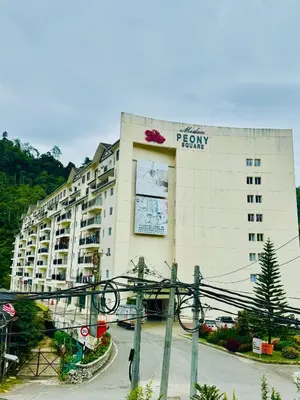 a large building with a sign on the side of it at Rich field Cameron Highlands Homestay-Peony Square-3BDR 2BTH-8PAX in Cameron Highlands