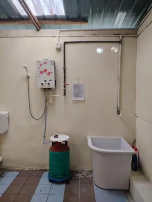 a bathroom with a toilet and a bath tub at Fantasy Stay Cameron Highlands in Kampung Kuala Terla
