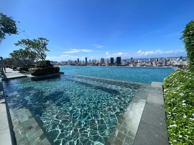 a swimming pool with a city skyline in the background at Rooftop Pool, Up to 6 Pax, 2 Bedrooms, 2 Bathrooms, 2 Car Parks by Star Home in George Town