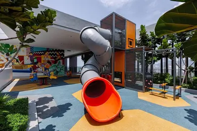 a playground in a house with a slide at Rooftop Pool, Up to 6 Pax, 2 Bedrooms, 2 Bathrooms, 2 Car Parks by Star Home in George Town
