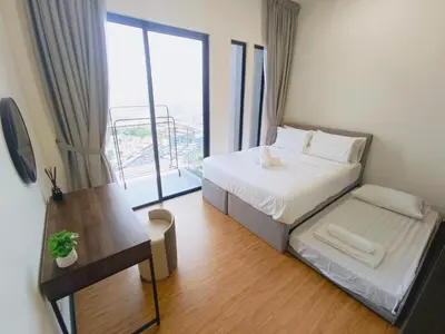 a bedroom with a bed and a large window at Rooftop Pool, Up to 6 Pax, 2 Bedrooms, 2 Bathrooms, 2 Car Parks by Star Home in George Town