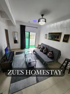 a living room with a couch and a table at Zuls Apartment Homestay Cameron Highlands in Tanah Rata