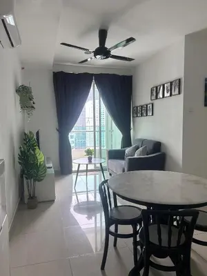 a living room with a ceiling fan and a table at Georgetown 2R1B Gleneagle Gurney City Sea view in George Town