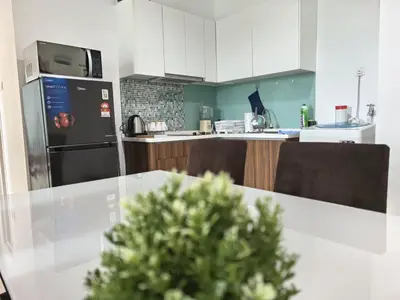 a kitchen with a table with a christmas tree on it at City Sea View 2R2B Georgetown Gleneagle 9pax in George Town