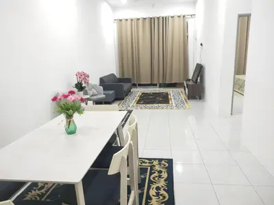 a living room with a table and a couch at Hannan Homestay in Kuala Lipis