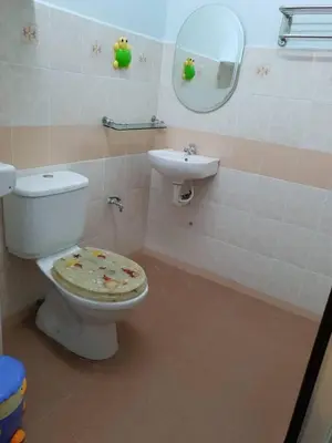 a dirty bathroom with a toilet and a sink at SRS WIN Homestay BPJ in Sungai Petani