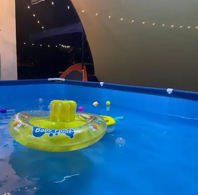 a toy boat in the water in a pool at Aileen Homestay Swimming Pool in Batu Gajah