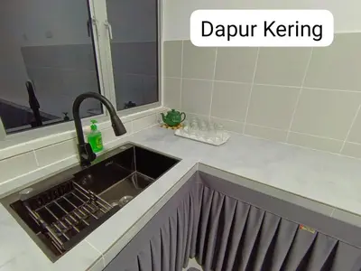 a sink in a kitchen with the words dapur kering at Homestay AinulZahra- For Malays Only in Seri Iskandar