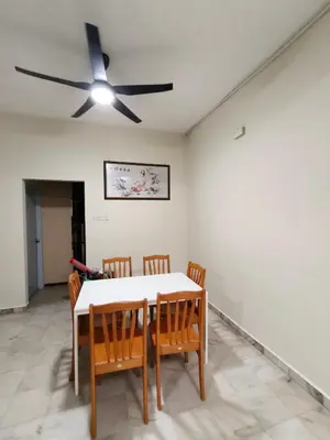 a dining room with a table and chairs and a ceiling fan at GHome Cheerful comfort home in Butterworth