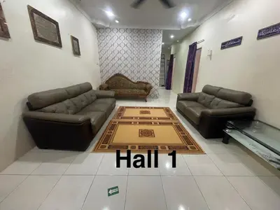 a living room with two couches and a table at ZzHomestay