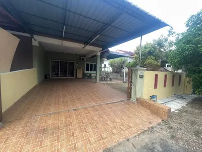 a brick patio with a blue roof on a house at ZzHomestay
