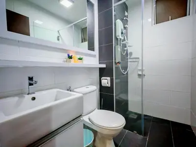 a bathroom with a toilet and a sink and a shower at Ipoh Majestic Modern City 2BR Condo - Food Street in Ipoh