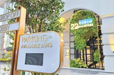 a sign in front of a parking available lot at SkyPool at 22Macalisterz - Georgetown City Centre, 4pax by PG Home in George Town