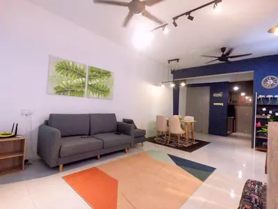 a living room with a couch and a table at HomeStay Amer in Ipoh