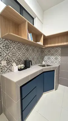 a kitchen with a sink and a tile wall at StudioMimi Near UTP UiTM Seri Iskandar in Seri Iskandar