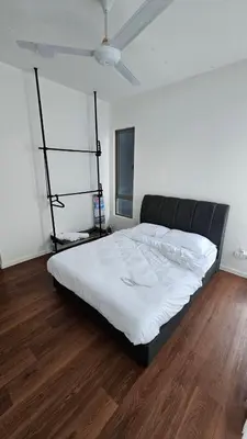 a large bed in a room with a wooden floor at CAMERON HIGHLAND BRINCHANG KEA FARM Homestay By Dcozy 6-7pax in Brinchang