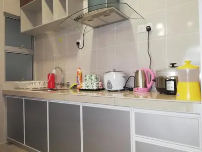a kitchen with a counter top with many appliances at COOL Stay Cameron Golden Hills in Brinchang