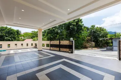 an empty patio with a gate in a house at Comfy Bungalow Family House Pg Hill & Kek Lok Si in Ayer Itam