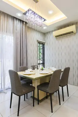 a dining room with a table and chairs at Comfy Bungalow Family House Pg Hill & Kek Lok Si in Ayer Itam