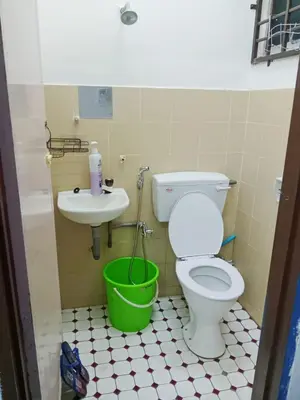 a bathroom with a toilet and a sink at Homestay Kak Kiah Taiping in Taiping