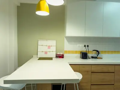 a kitchen with a white counter top in a kitchen at Gracious Green Gurney in George Town