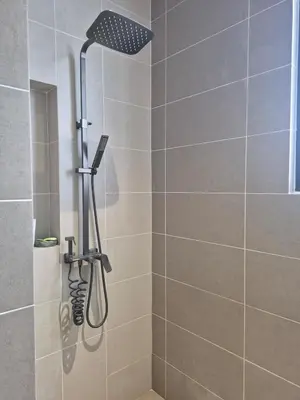 a shower with a shower head in a bathroom at Mega Seaview Escape - Butterworth Penang in Butterworth