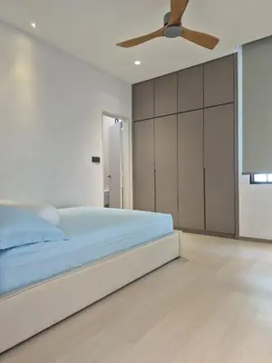 a bedroom with a bed and a ceiling fan at Mega Seaview Escape - Butterworth Penang in Butterworth