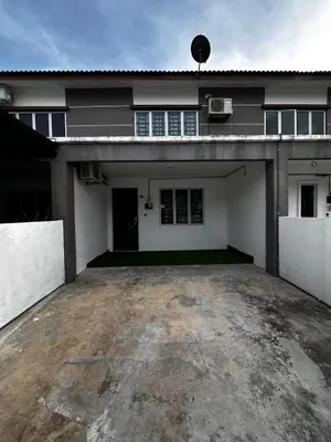 an empty parking lot in front of a house at Teratak MakTeh in Kampong Ayer Melintas Besar