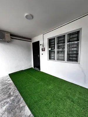 a white room with a green carpet on the floor at Teratak MakTeh in Kampong Ayer Melintas Besar