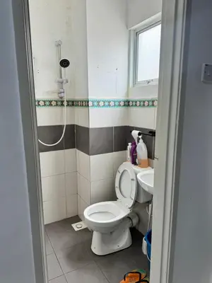 a bathroom with a toilet and a sink at AYAAN HOMESTAY Tanah Rata with Netflix in Tanah Rata
