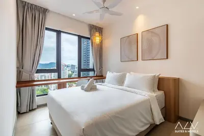 a bedroom with a bed and a large window at 22 Macalisterz's Armoire Collection by ALV in George Town