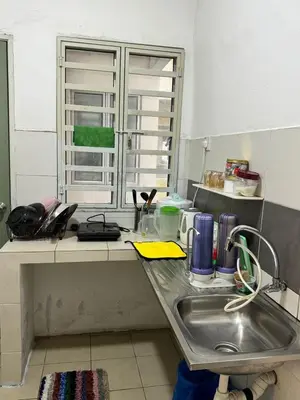a kitchen counter with a sink and a window at AYAAN MUSLIMAH Home at Tanah Rata in Tanah Rata