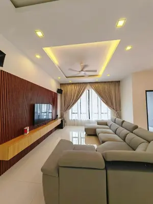 a waiting room with couches and a flat screen tv at Ipoh M Villa 2 in Ipoh