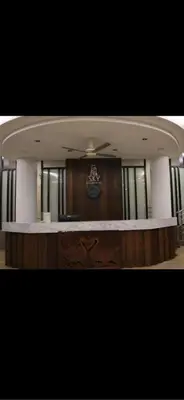 a view of a court room with a clock on the wall at Deluxe Apartment at CintaSayang Resort in Sungai Petani