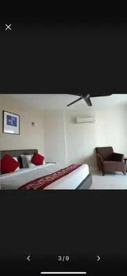 a hotel room with two beds and a couch at Premium Condo at Cinta Sayang Club in Sungai Petani