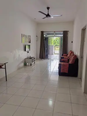 a living room with a couch and a table at Homestay Rumahku Jana in Kamunting