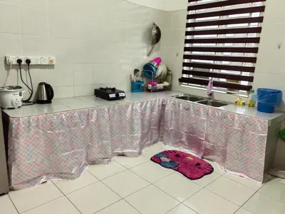 a kitchen with a counter top and a sink at Homestay Rumahku Jana in Kamunting