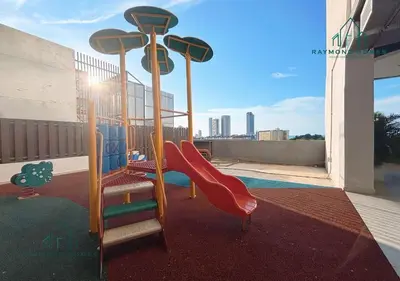 a playground with a slide on a balcony at Harborlight Jazz Suite in Tanjong Tokong