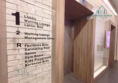 a sign on the wall of a building with signs on it at Harborlight Jazz Suite in Tanjong Tokong