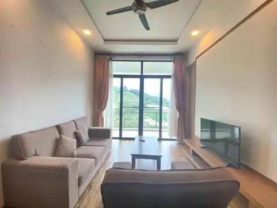 a living room with a couch and a flat screen tv at Nova Homestay Cameron Highlands in Brinchang
