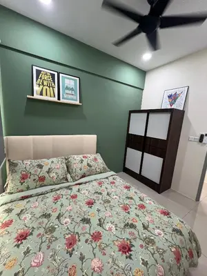 a bedroom with a bed and a ceiling fan at Cozy Modern Condo with Pool & City Access in Bayan Lepas
