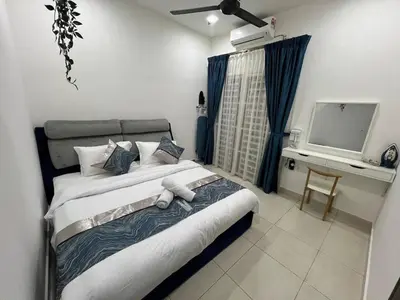 a bedroom with a large bed and a television at Huwayna Private Pool Homestay M U S L I M sahaja in Kepala Batas