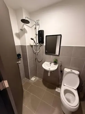 a bathroom with a shower and a toilet and a sink at Huwayna Private Pool Homestay M U S L I M sahaja in Kepala Batas