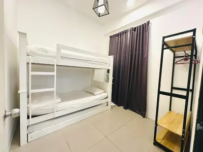 a room with two bunk beds and a window at Homestay Golden Hills in Brinchang