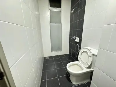 a small bathroom with a toilet and a window at Homestay Golden Hills in Brinchang