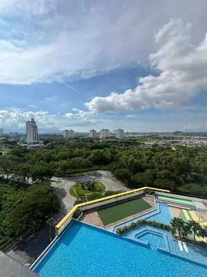 an overhead view of a swimming pool with a tennis court at Metropol by BRB in Bukit Mertajam