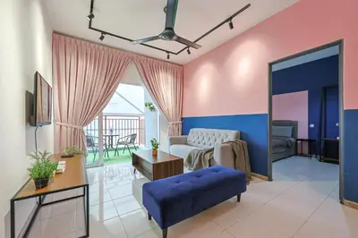 a living room with a couch and a table at Emerald Avenue Brinchang Near Centrum- Cozy Family Stay Clover Home 5-06 in Brinchang
